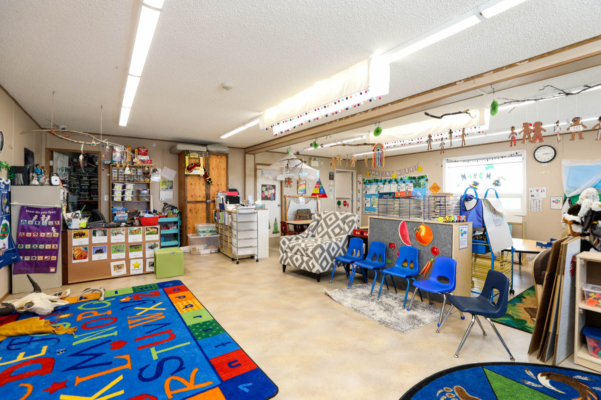 aakom kiyii health services daycare room full of toys, play mats and learning areas for children